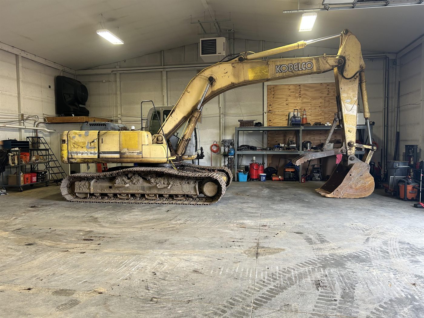 Shop repair work on heavy equipment inside Extreme Machinery