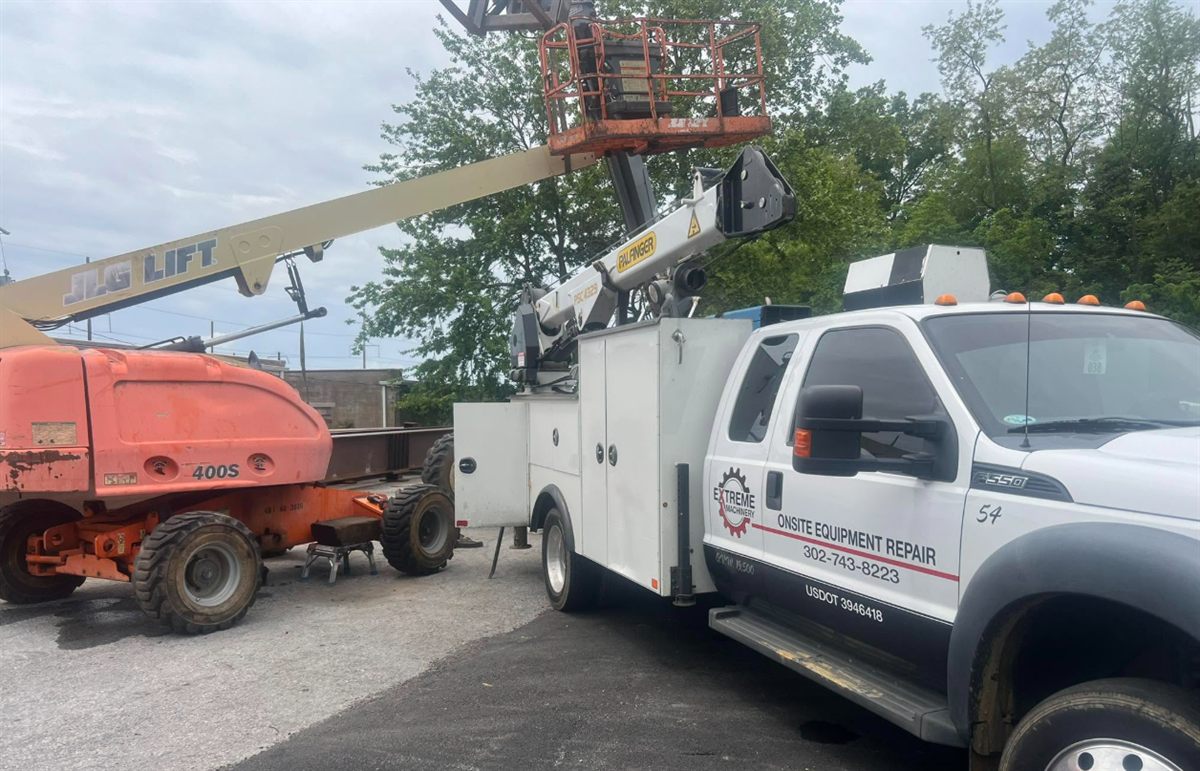 Extreme Machinery service truck staged beside lift equipment