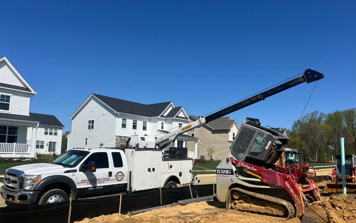 Extreme Machinery service truck lifting equipment during a field call
