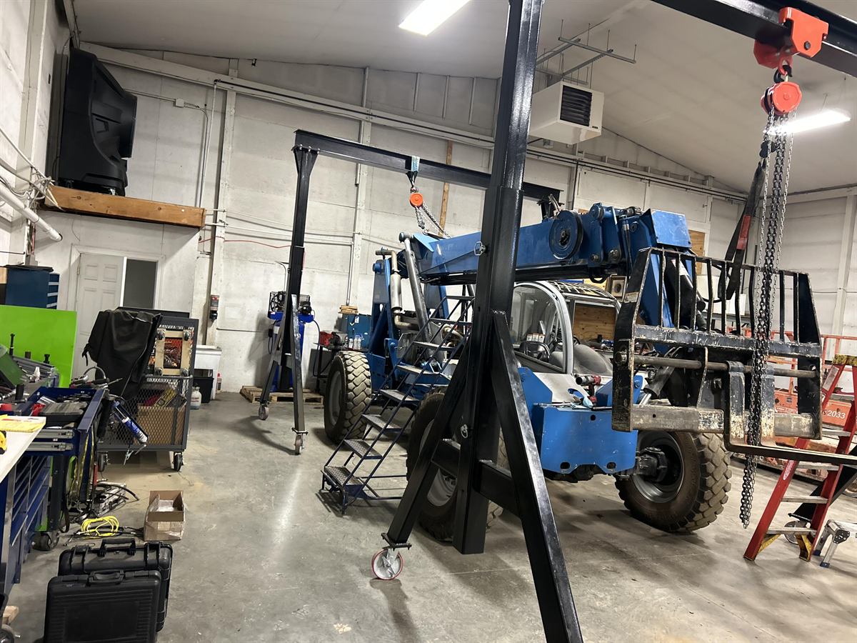 Lift equipment being serviced inside the shop